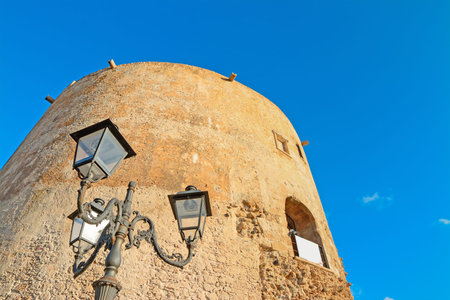 lamppost close to an old bastion in Alghero, Sardiniaの写真素材