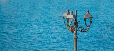 metal lamppost by Alghero harborの写真素材