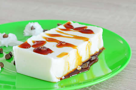 close up of a panna cotta  with caramel and whipped creamの写真素材