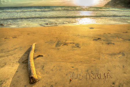 "australia" written on a tropical beach at sunsetの写真素材