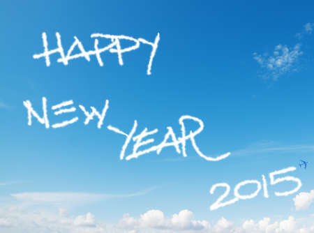 \"happy new year 2015\" written in the sky with contrails left by airplaneの写真素材
