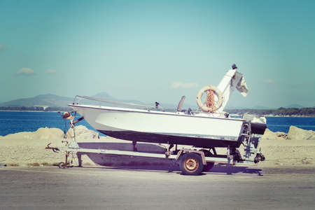 boat on a trailer by the dock. iso 100, processed for vintage tone effect.の写真素材