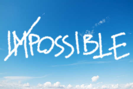 "impossible" written in the blue skyの写真素材