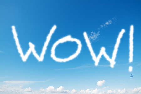 wow written in the blue skyの写真素材