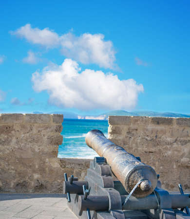 ancient cannon in Alghero bastion, Italyの写真素材