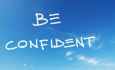 "be confident" written in a blue sky with fireworksの写真素材