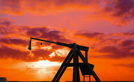 catapult silhouette under a red sunset.の写真素材