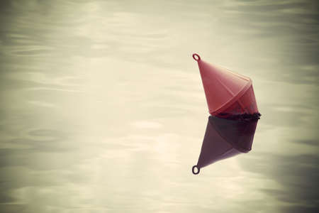 red buoy in the water.の写真素材