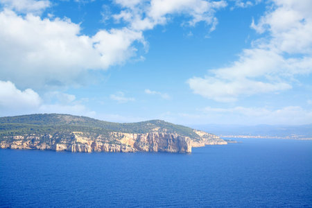 rocky shore under a cloudy sky. Shot in Sardinia, Italy.の写真素材