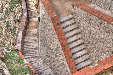 rocky stairway in Capo Caccia, Sardinia. Processed for hdr tone mapping effect.の写真素材