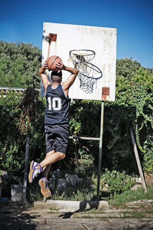 basketball player dunking in the parkの写真素材