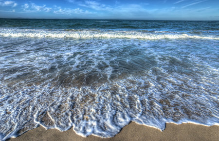waves by the foreshore in Sardinia, Italy. Processed for hdr tone mapping effect.