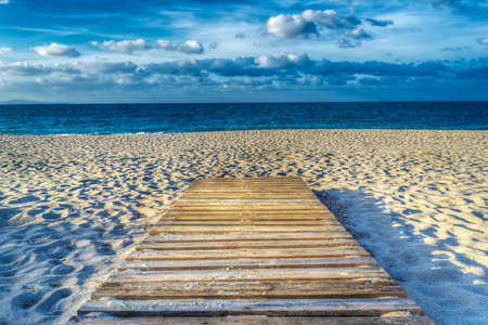 wooden boardwalk on the sand in hdr tone mapping effectの写真素材