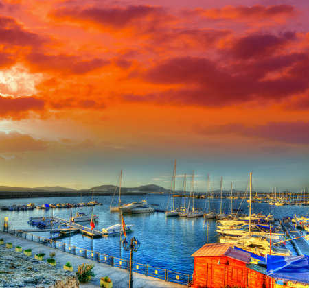 colorful sunset in Alghero harborの写真素材