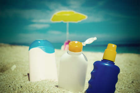 suntan lotions on the sand in vintage effectの写真素材