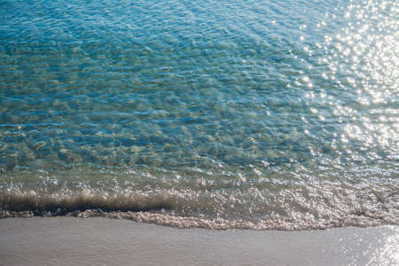close up of a foreshore with sunlight reflectionの写真素材