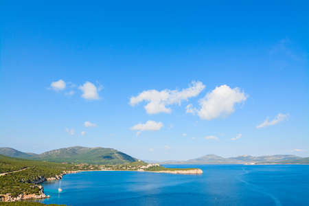Capo Caccia shoreline under a blue sky. Shot in Sardinia, Italyの写真素材