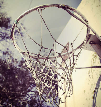 basketball hoop seen from below in vintage toneの写真素材