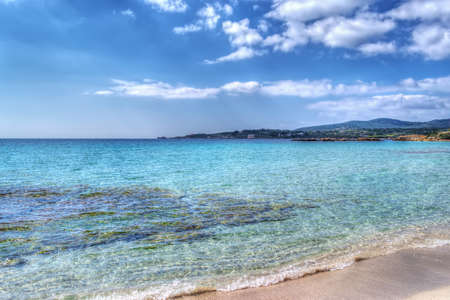 Le Bombarde beach foreshore on a clear day. Processed for hdr tone mapping effectの写真素材