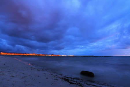motion blur in Alghero shoreline on a cloudy night, Sardiniaの写真素材