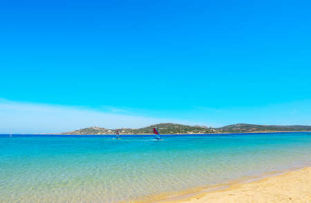 windsurfing in Porto Pollo beach, Sardiniaの写真素材