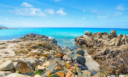 Santa Reparata shoreline under a cloudy sky. Shot in Sardinia, Italyの写真素材