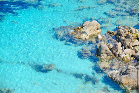 grey rocks in Capo Testa clear water, Sardiniaの写真素材