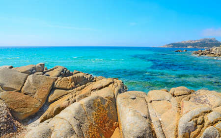 yellow rocks in Santa Reparata beach, Sardiniaの写真素材