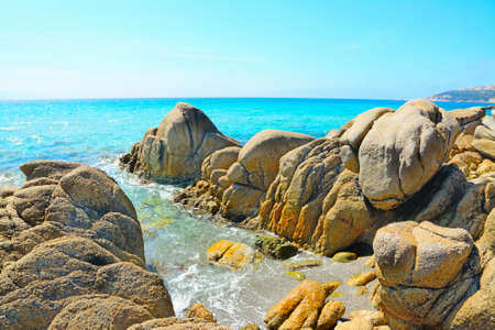 yellow rocks in Santa Reparata beach, Sardiniaの写真素材