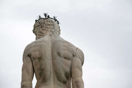 back view of Neptune statue in Piazza della Signoria in Florence, Italyの写真素材