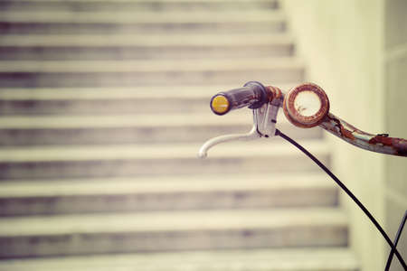 close up of a rusty bicycle handlebar in vintage effectの写真素材