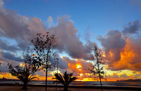 colorful coastline at sunset in Alghero, Italyの写真素材