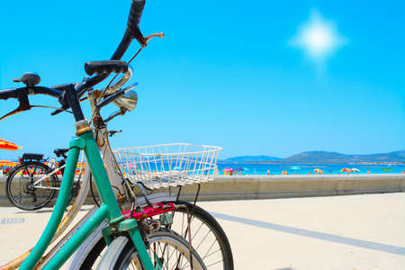 vintage bikes by hte sea in Alghero, Italyの写真素材
