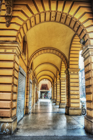 yellow arcade in Bologna, Italyの写真素材