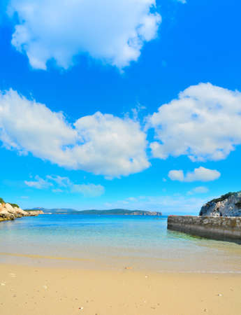 golden shore under a cloudy sky in Sardinia, Italyの写真素材