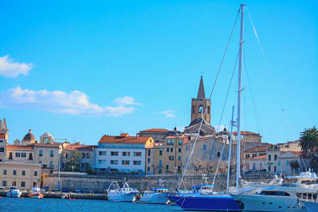 Alghero steeple seen from the harbor, Sardiniaの写真素材