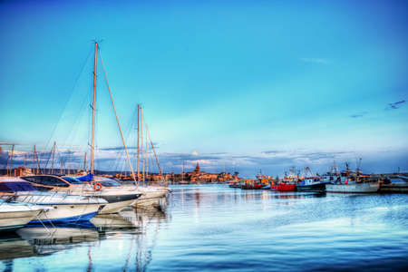 boats in Alghero harbor in hdr tone mapping effectの写真素材