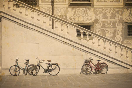 bicycle by an historic stairway in Pisa in vintage tone, Italyの写真素材