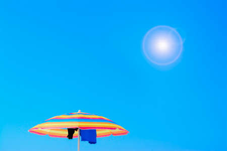 colorful parasol under a shining sunの写真素材