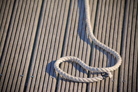 sea rope on a wooden background in vintage toneの写真素材