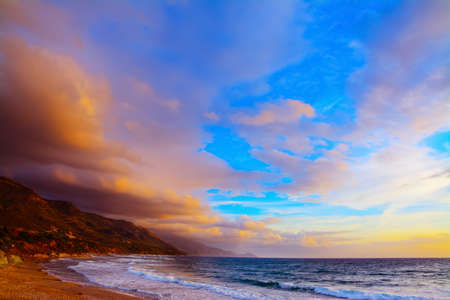 Poglina beach under a colorful sky at sunset, Sardiniaの写真素材
