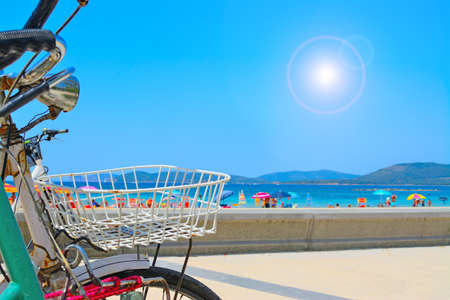 old bikes by the sea in Alghero, Italyの写真素材