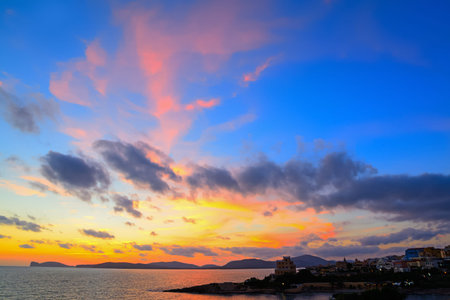 colorful sunset over Alghero shoreline, Sardiniaの写真素材