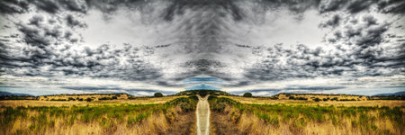 country road under a dramatic sky in hdr tone mapping effect