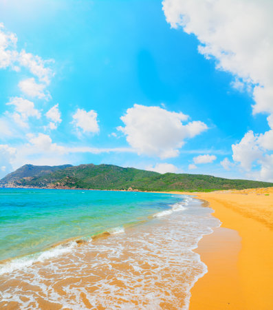 Porto Ferro beach under white clouds, Sardiniaの写真素材