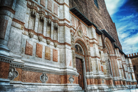 detail of San Petronio cathedral front view in Bologna, Italy
