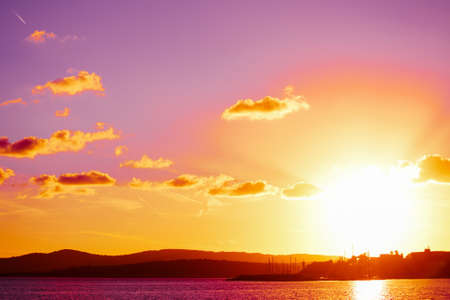 colorful sky at sunset in Sardinia, Italyの写真素材