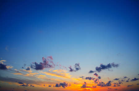 colorful sunset with dark cloudsの写真素材