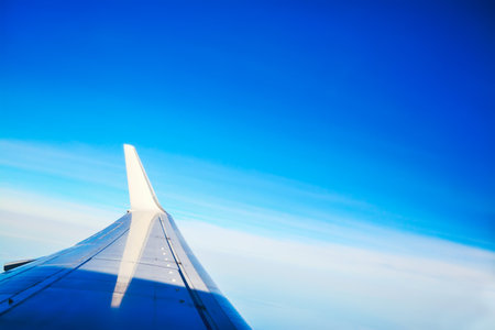 airplane winglet in the blue sky