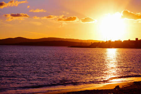 pink sunset in Fertilia, Italyの写真素材